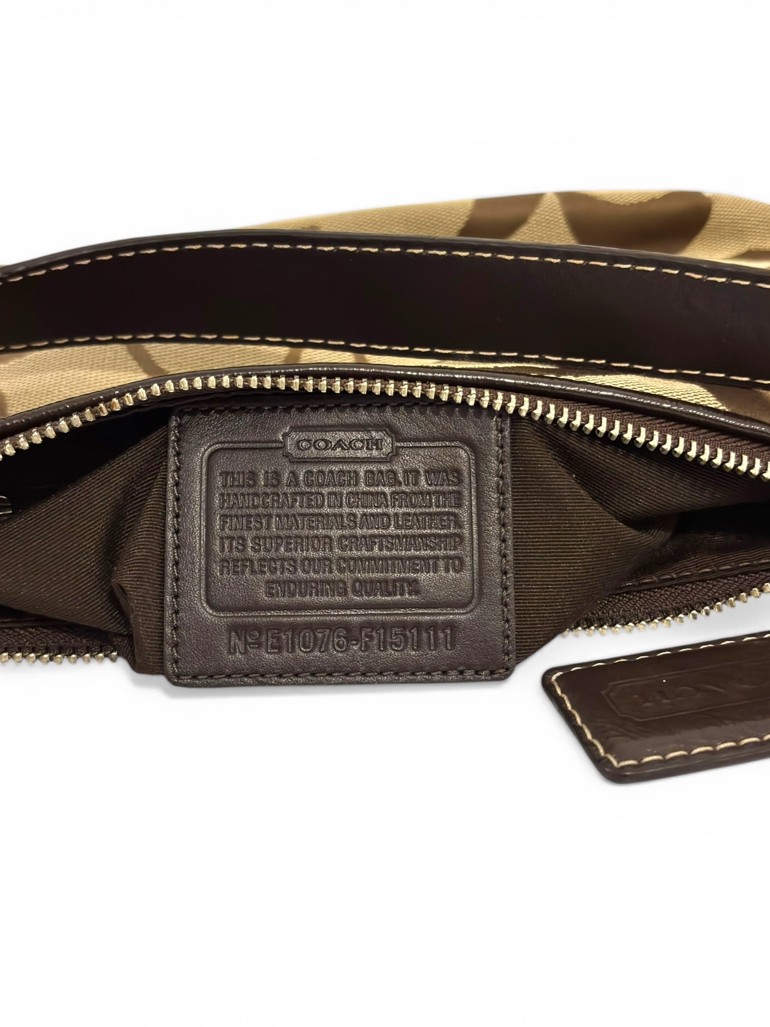 Coach Brown Signature Stripe Demi Baguette
Canvas & Patent Leather Shoulder Bag