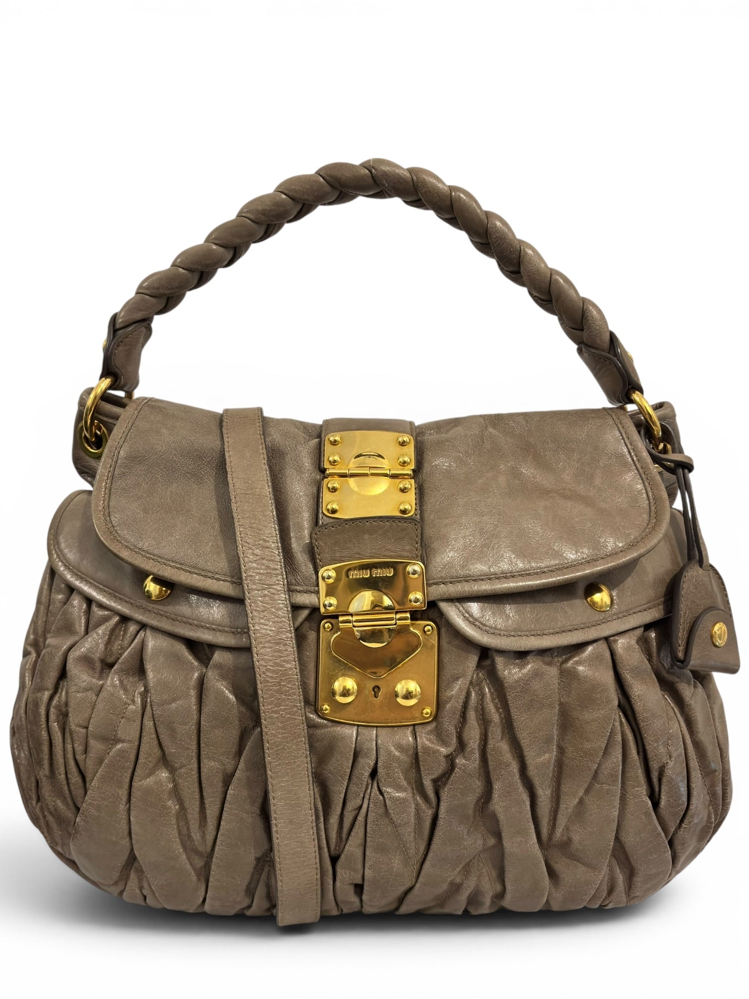 Miu Miu Vitello Lux Matelassé Coffer Hobo Taupe
Leather Gold Hardware Shoulder Bag